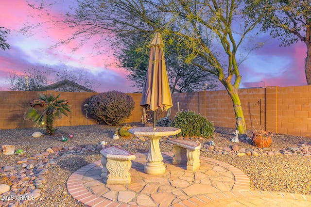 view of patio terrace at dusk