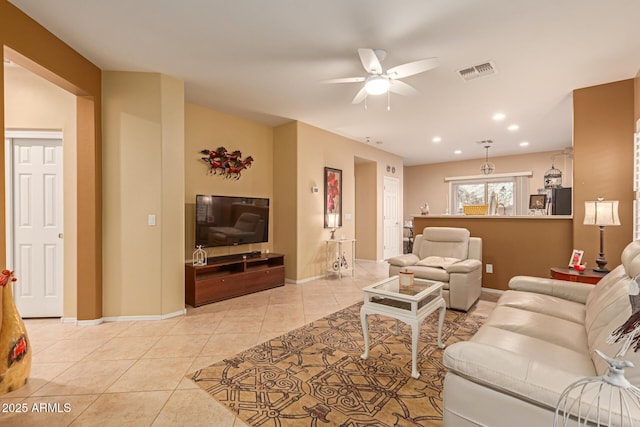 tiled living room with ceiling fan