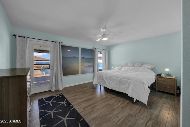 bedroom with ceiling fan, dark hardwood / wood-style flooring, access to outside, and multiple windows