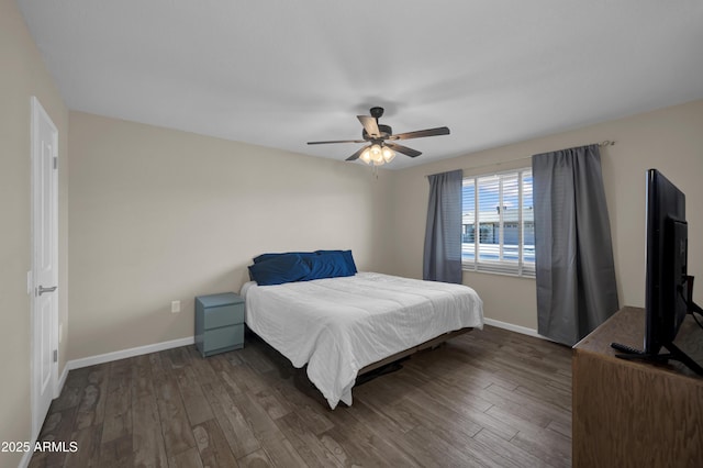 bedroom featuring ceiling fan and dark hardwood / wood-style floors