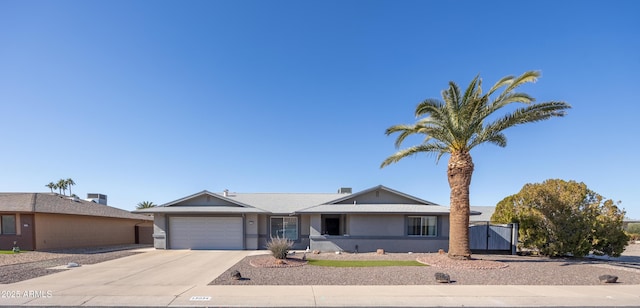 ranch-style home featuring a garage