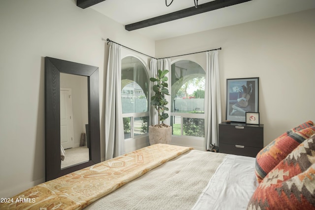 bedroom with beam ceiling