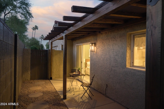 view of patio terrace at dusk