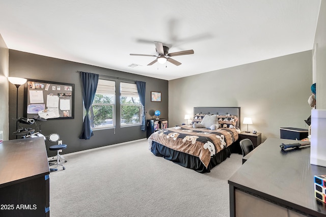 bedroom featuring visible vents, baseboards, carpet, and a ceiling fan