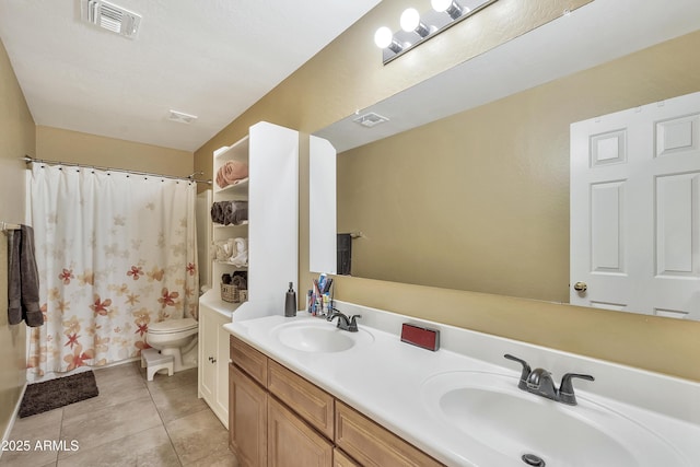 full bathroom featuring tile patterned floors, visible vents, toilet, and a sink