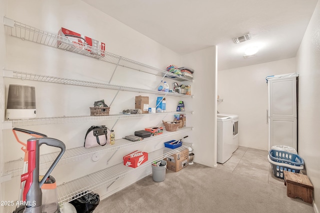 interior space with washer and clothes dryer and visible vents