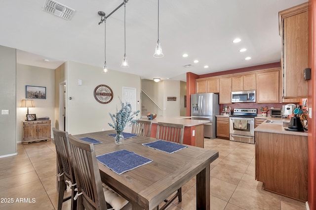 dining space featuring light tile patterned floors, visible vents, and recessed lighting