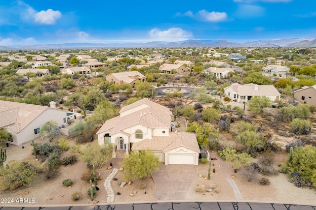 birds eye view of property featuring a mountain view