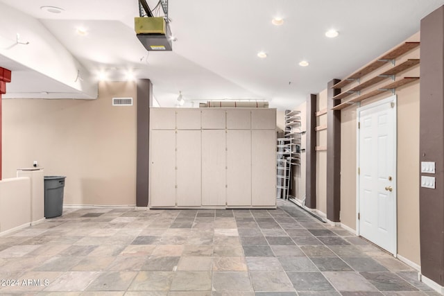 interior space with a garage door opener