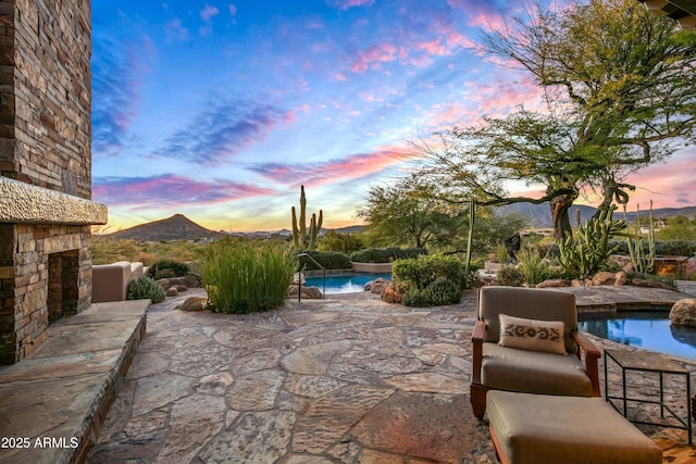 patio terrace at dusk with a mountain view