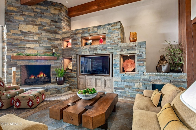 living room featuring a fireplace and beamed ceiling