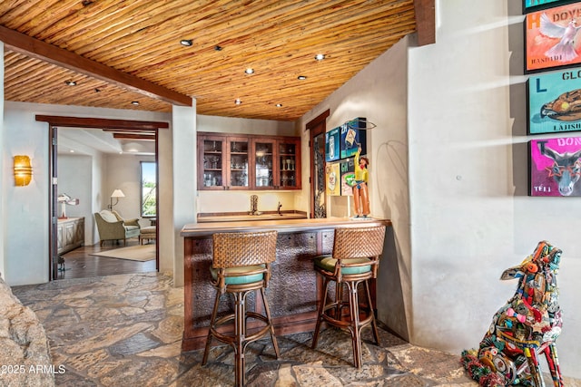 bar featuring beamed ceiling and wood ceiling