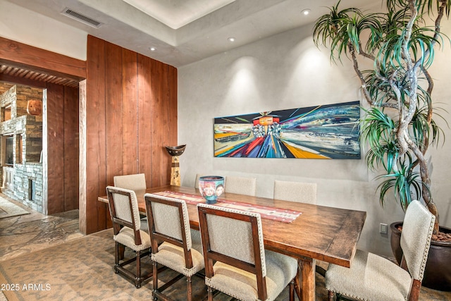 dining area with wood walls