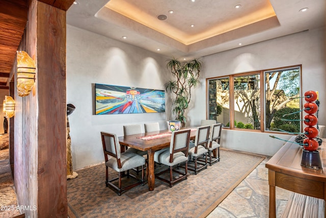 dining space with a tray ceiling