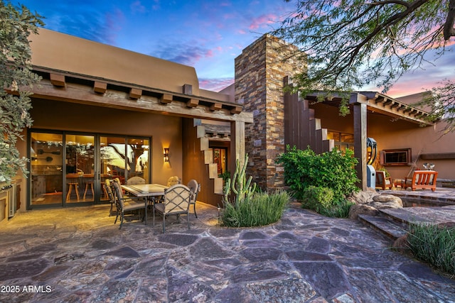 view of patio terrace at dusk