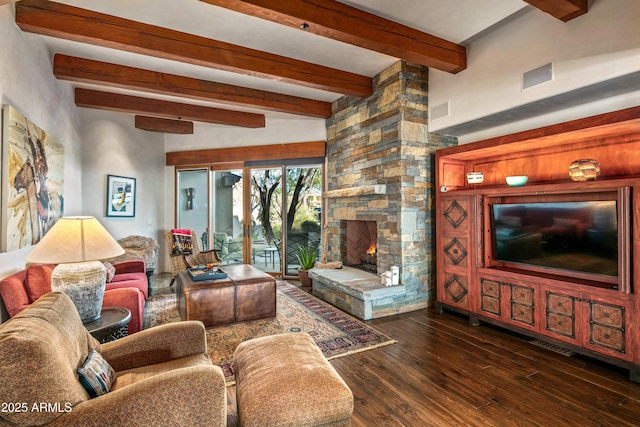 living room featuring beamed ceiling, a fireplace, and dark wood-type flooring