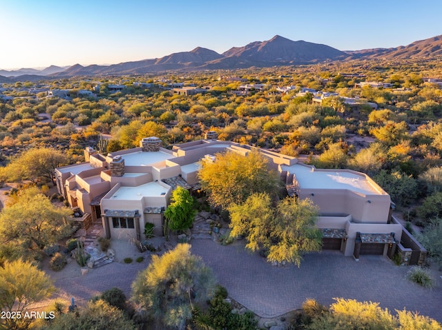 birds eye view of property with a mountain view