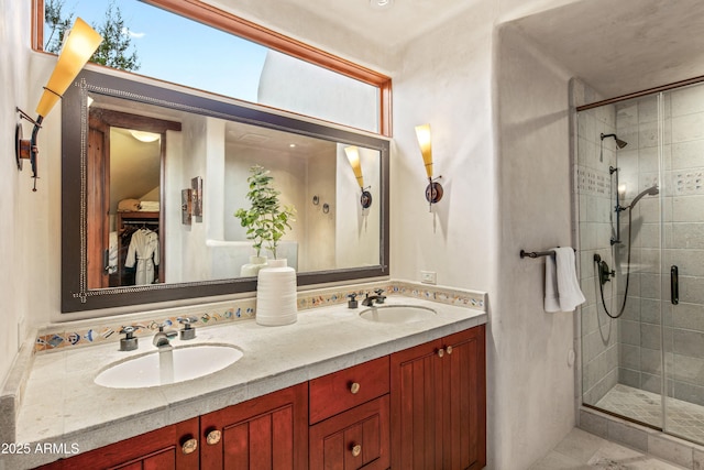 bathroom featuring vanity and a shower with shower door