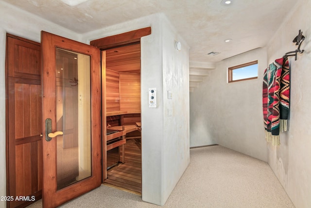 view of sauna featuring carpet flooring