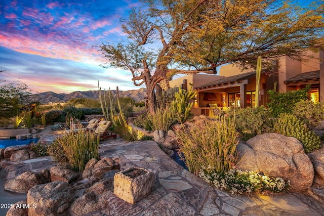 yard at dusk with a mountain view