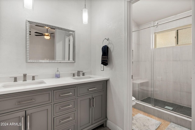 bathroom featuring walk in shower, vanity, and toilet