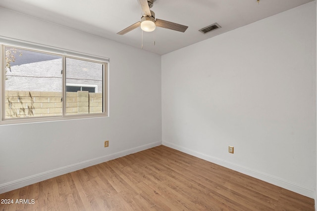 empty room featuring light hardwood / wood-style flooring and ceiling fan