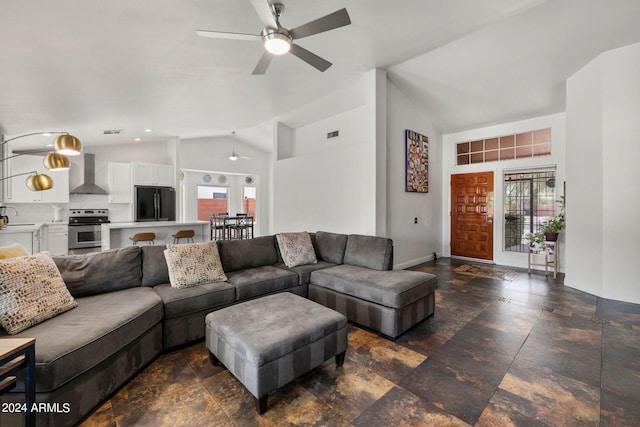 living room with ceiling fan, lofted ceiling, and sink