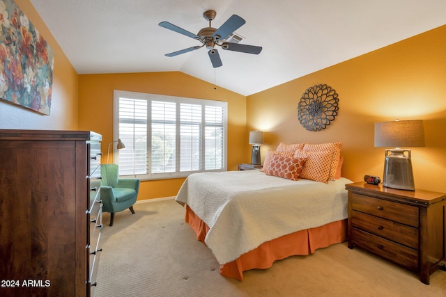 carpeted bedroom with vaulted ceiling and ceiling fan