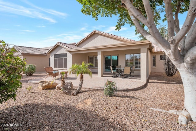 rear view of house with a patio area