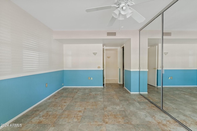 unfurnished bedroom with a closet and ceiling fan