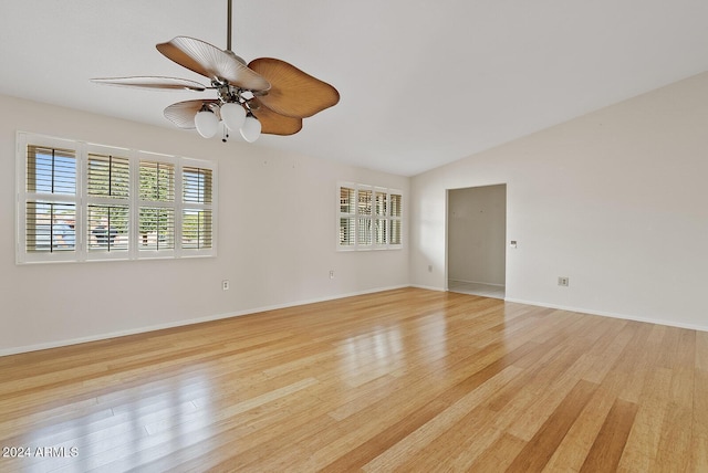 spare room featuring ceiling fan, light hardwood / wood-style floors, and lofted ceiling