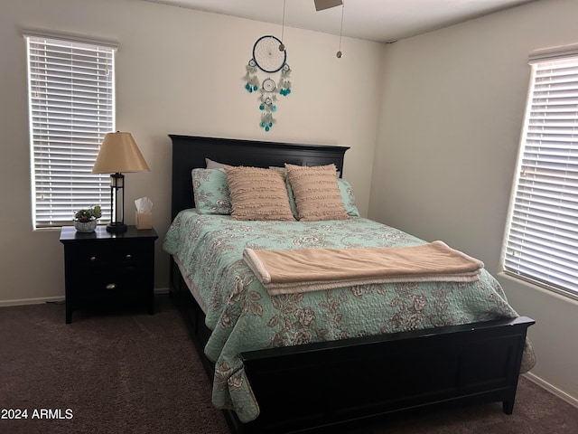 carpeted bedroom featuring ceiling fan