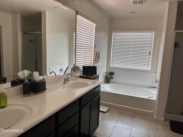 bathroom featuring vanity, tile patterned floors, and separate shower and tub