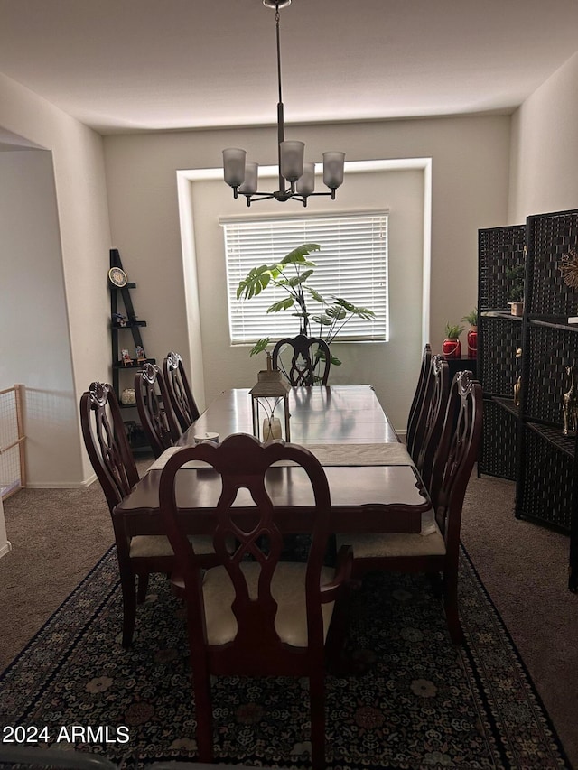 carpeted dining area with a notable chandelier