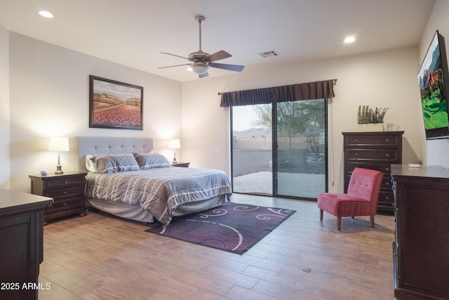 bedroom featuring ceiling fan and access to exterior