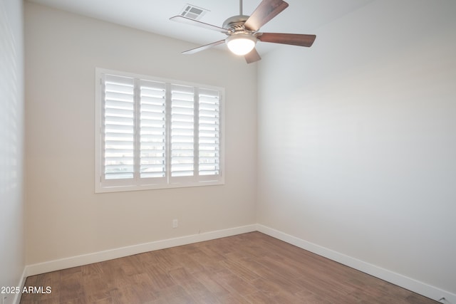 empty room featuring ceiling fan and light hardwood / wood-style flooring