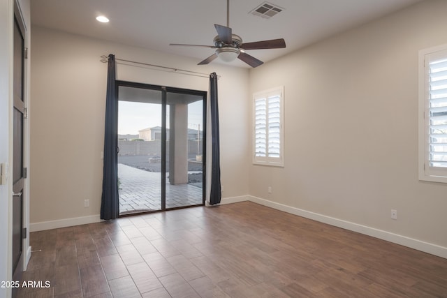 unfurnished room featuring hardwood / wood-style flooring and ceiling fan