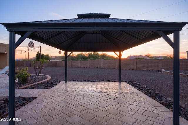 patio terrace at dusk with a gazebo