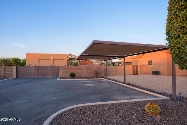 view of vehicle parking featuring a carport