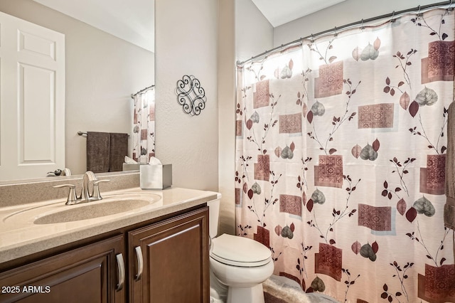 bathroom with toilet, a shower with shower curtain, and vanity