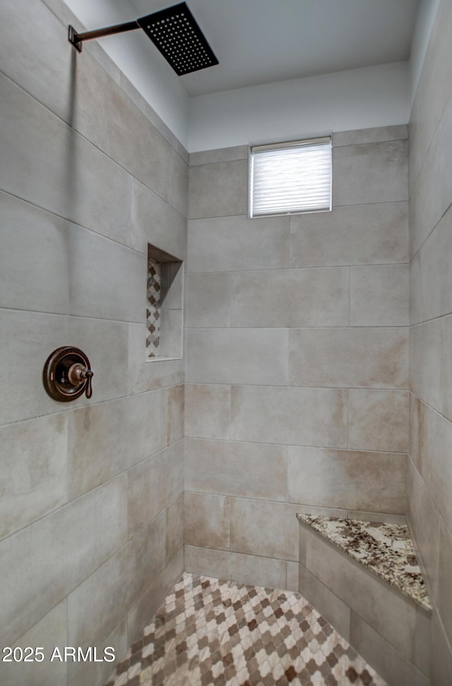 bathroom featuring tiled shower