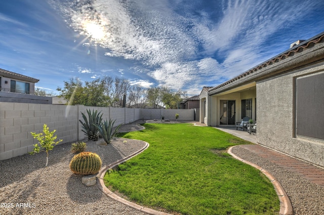 view of yard with a fenced backyard and a patio