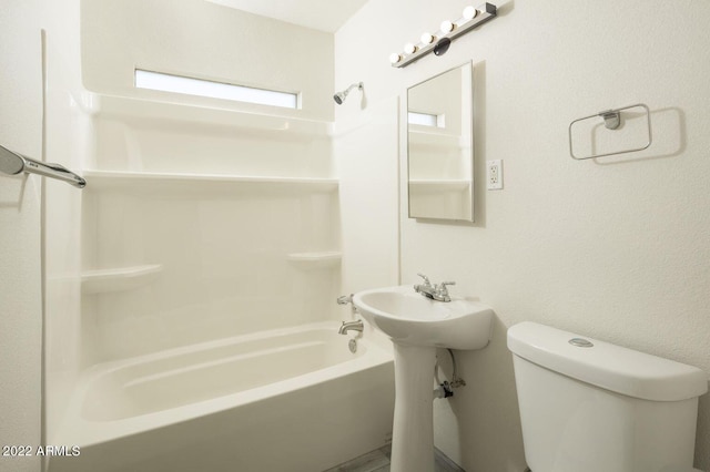 full bathroom featuring toilet and tub / shower combination