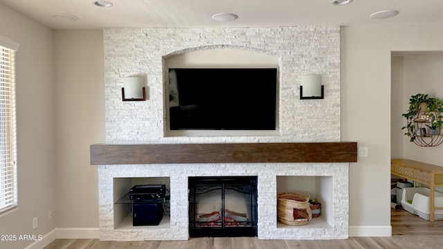 room details featuring hardwood / wood-style floors and a fireplace