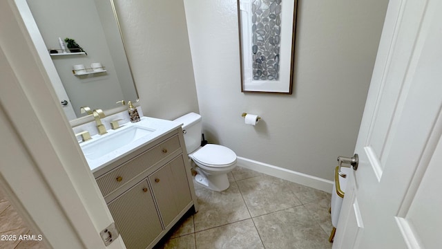 bathroom featuring tile patterned floors, toilet, and vanity