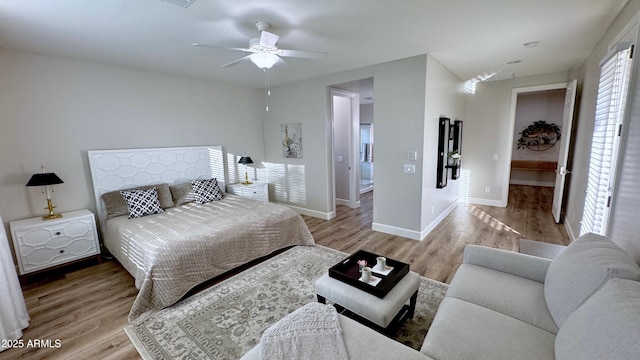 bedroom featuring ceiling fan and light wood-type flooring