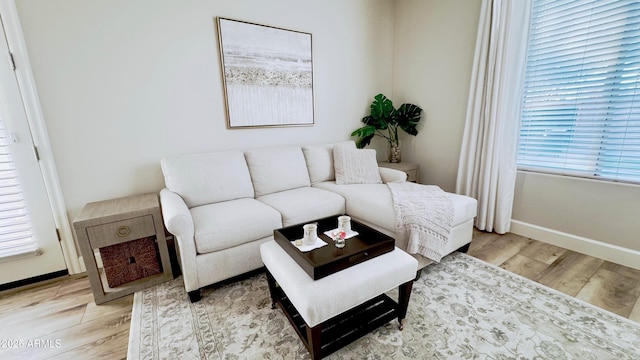 living room with light hardwood / wood-style flooring