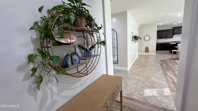 hallway featuring light tile patterned floors