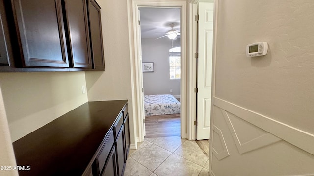 corridor featuring light tile patterned floors