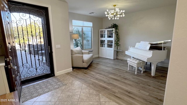 entrance foyer with an inviting chandelier and light tile patterned flooring